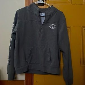 gray crew neck, with zip up on the top